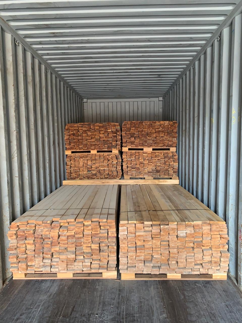 Teak boards loaded inside a shipping container